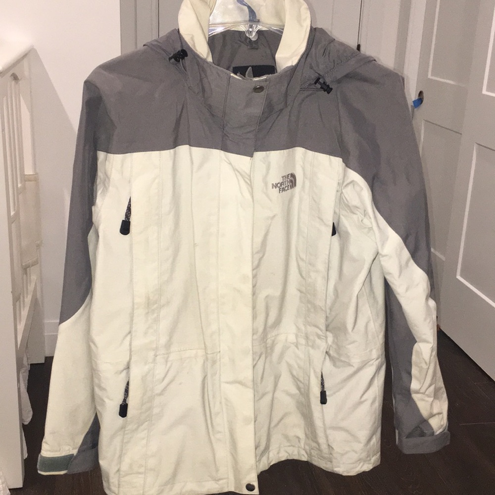 The North Face cream windbreaker size small
